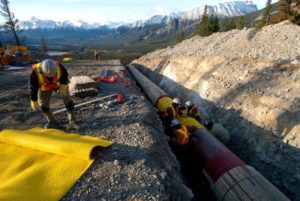 File Photo: Workers construct the Anchor Loop section of Kinder Morgan's Trans Canada Pipeline in Jasper National Park