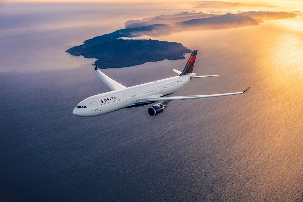 Airbus A330 Over Ocean at Sunset